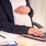 Pregnant Business Woman working on laptop