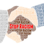 Stop racism written as part of handshake illustration