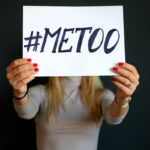 #metoo sign in front of blonde woman