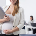 female worker holding work documents