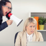 Boss yelling at employee on megaphone