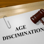 Age discrimination document with gavel on table