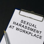 Sexual harassment at workplace word on paper