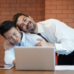 Man or gay boss touching and hug his Asian employee or colleague body in office as sexual harassment and enforcement