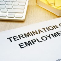 Termination of Employment on an office desk.