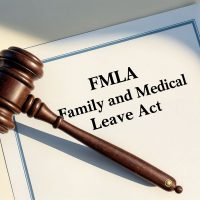 family and medical leave act written on a sheet of paper